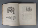 an open book with a drawing of a castle on it
