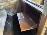 a small desk in the back of a truck
