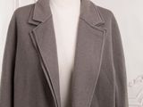 the coat is made of wool and has a long collar