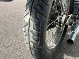 a motorcycle that is parked on the side of the road
