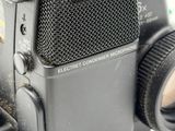 a close up of a camera with a lens attached to it