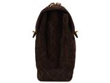the back view of a brown handbag on a white background
