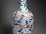 an image of a vase with a dragon design on it