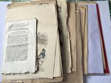 a pile of old papers sitting on a table