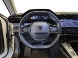 the interior of a car with a steering wheel, dashboard, and display screen