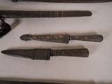 five different types of knives on a table