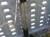 a metal fence that has a metal pole attached to it