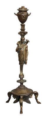 a bronze statue of a woman holding a vase on a stand
