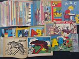 many children ' s books on the table together