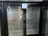 two glass doors that are open in a room