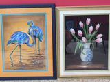 two framed pictures of flamingos and tulips in a vase