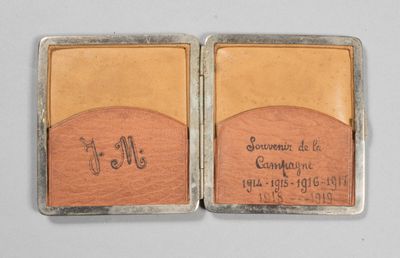 pair of leather business cards with engraved initials on them