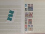 an open book with stamps on it on a table