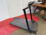 a tread machine that is sitting on the floor