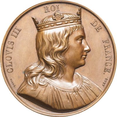 l'image d'une pièce d'or sur laquelle figure le portrait d'un homme coiffé d'une couronne