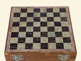 marble chess board in a wooden box on a white background