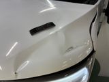 a close up of a white truck with a remote control