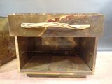 a small wooden box that has a handle on it