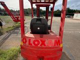 an image of a red forklift parked in a parking lot