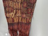 a close up of a piece of cloth on a white surface