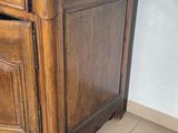 a wooden cabinet with a drawer on top of it