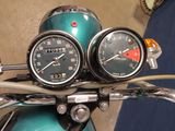 two gauges on the handlebars of a motorcycle