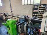 a green machine that is sitting in a room
