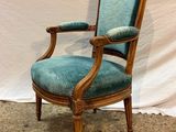 an image of a chair with a blue upholstered seat