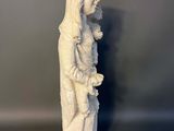 statue of a woman holding a baby in her arms