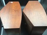 pair of mid century style speakers with wooden bases