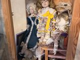 a doll in a wooden case with dolls in it