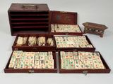 many pieces of domino board in a wooden box