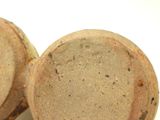two pieces of bread sitting next to each other on a white surface