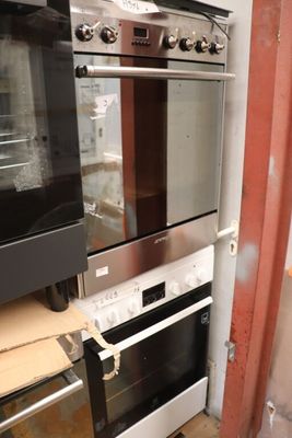 two ovens that are being installed in the kitchen
