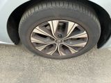 a close up of a car ' s tire on the pavement