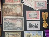 several different types of paper money are laid out on a table