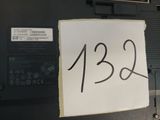 a sign on the back of a laptop that says 1232
