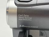 a silver camera that is sitting on a table