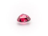 a close up of a pink diamond on a white background