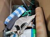 a cardboard box filled with various items and a umbrella
