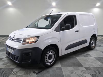 the white van is parked on a checkered tile floor