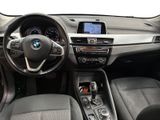 a view of the inside of a car with a steering wheel and dashboard