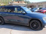mercedes gls parked in a parking lot with other cars in the background