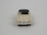 a small toy car that is sitting on a table