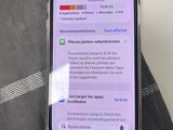 iphone x with notifications displayed on screen sitting on a bed