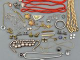 an assortment of various jewelry including necklaces, bracelets, and rings