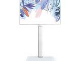 an image of a flat screen tv on a stand with a painting on it