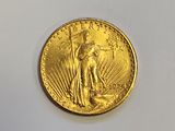 a close up of a gold coin on a white surface