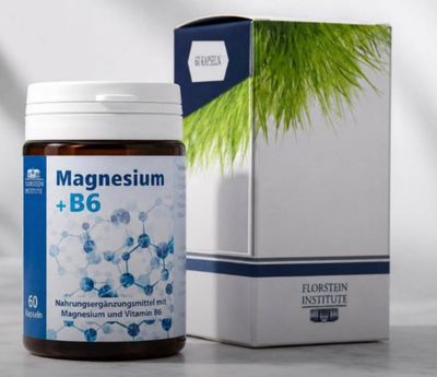 a close up of a bottle of magnesium b6 next to a box