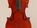 an old violin with a bow hanging from it ' s neck